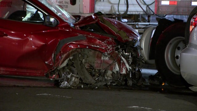 Red SUV with front end damage 