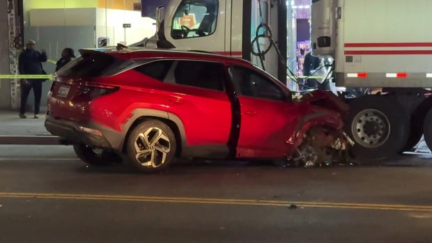 Red SUV with front end damage 