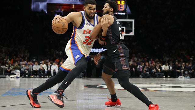 Karl-Anthony Towns #32 of the New York Knicks drives to the basket against Chaney Johnson #31 of the Brooklyn Nets during the fourth quarter at Barclays Center on March 20, 2026 in New York City. 