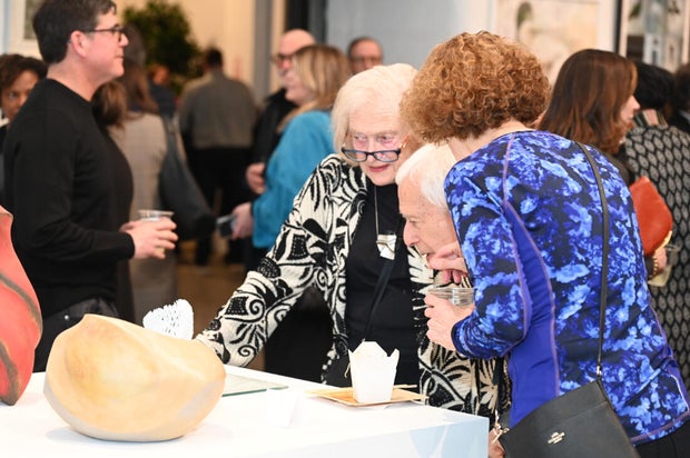 People pose for photos at Inliquid Art Bash 2026 