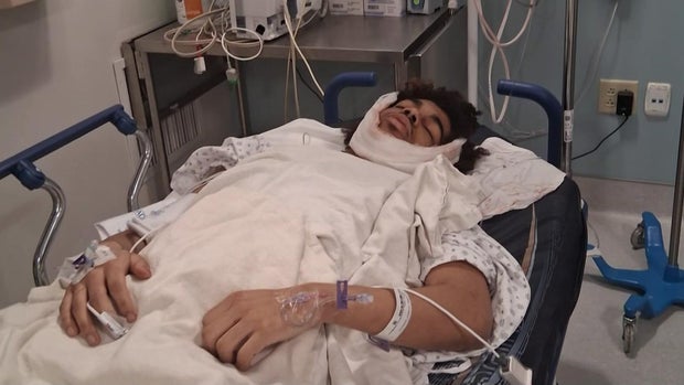 Yadreison Diaz in a hospital bed 
