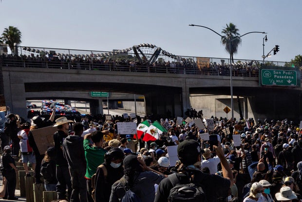 Protesters clash with law enforcement in downtown Los Angeles near the Federal Building and the Metropolitan Detention Center due to the immigration raids roil L.A.