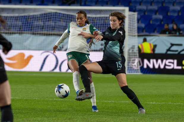 Ally Brazier (11) of the Denver Summit FC and Tierna 