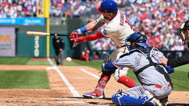 Philadelphia Phillies designated hitter Kyle Schwarber misses the ball during the game between the Philadelphia Phillies and the Texas Rangers on March 29 