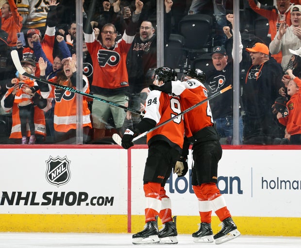 Philadelphia Flyers' Trevor Zegras holds onto Porter Martone's neck after Martone scored the game-winning goal in overtime to defeat the Boston Bruins 2-1 at the Xfinity Mobile Arena on April 5, 2026 