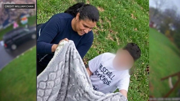 Woman and child holding blanket