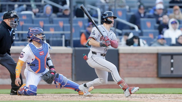 Corbin Carroll #7 of the Arizona Diamondbacks follows through on his fifth inning single against the New York Mets at Citi Field on April 07, 2026 in New York City. 