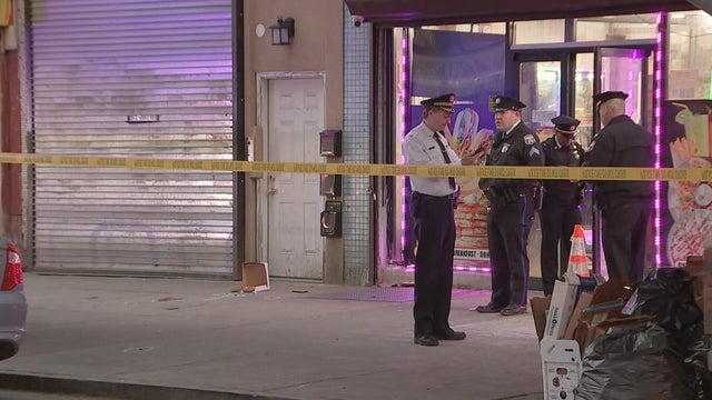 Overhead photo of the scene at 60th and Market streets, police cars and tape are at the intersection 