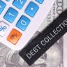 Calculator and "Debt Collection" label placed on US dollar bills, representing debt recovery, finance, and payment. 