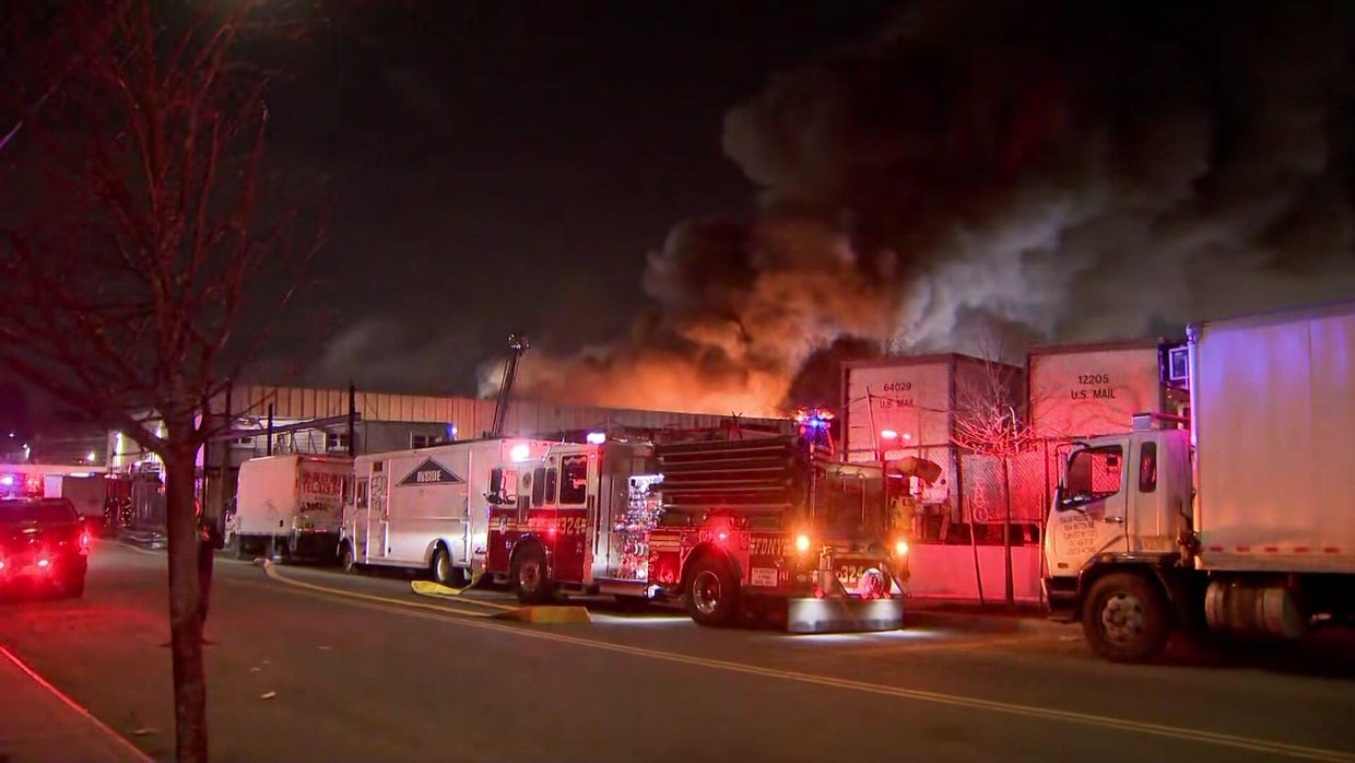 FDNY crews battle massive factory fire in Queens - CBS New York
