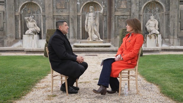 Father Manny Dorantes and Norah O'Donnell 