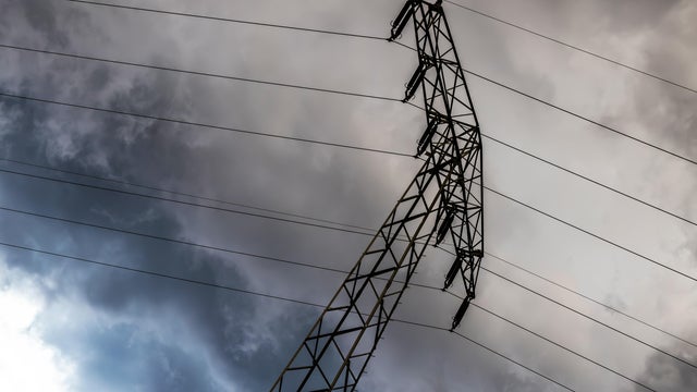 Electricity pylon with dark clouds 