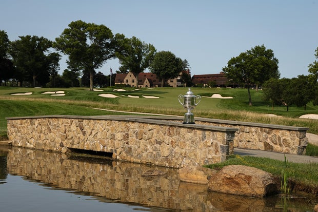 The Wanamaker Trophy sits on a stone wall near the 17th hole at Aronimink Golf Club 