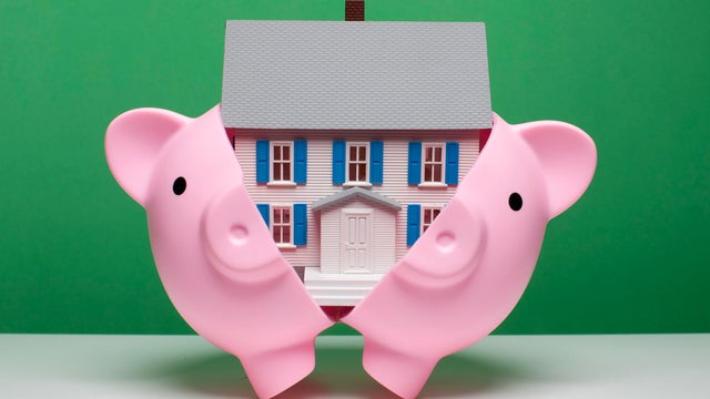 Saving for a home - House in piggy bank 