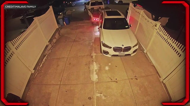 Car being towed out of driveway 