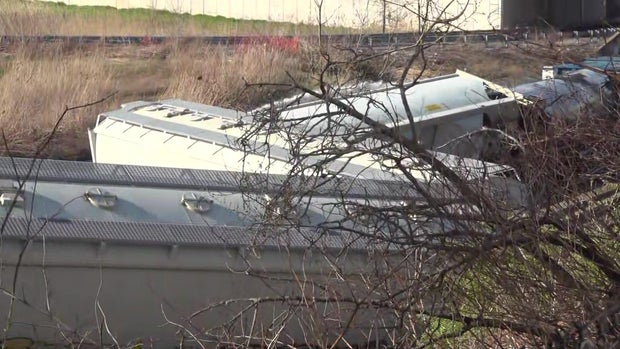 Derailed freight train cars 