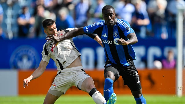 Robert Voloder #6 of Red Bull New York challenges Prince Owusu #9 of CF Montr&eacute;al during the MLS match in the first half at Saputo Stadium on April 18, 2026 in Montreal, Quebec, Canada. 
