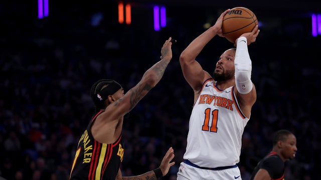 Jalen Brunson #11 of the New York Knicks takes a shot as Nickeil Alexander-Walker #7 of the Atlanta Hawks defends during the first half of Game One of the Eastern Conference First Round NBA Playoffs at Madison Square Garden on April 18, 2026 in New York City. 