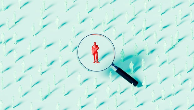 Businessman Under Magnifying Glass Concept of Recruitment and Selection 