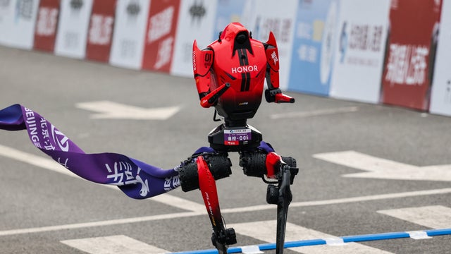 A Lightning humanoid robot by Honor crosses the finish line of the second Beijing E-Town Half Marathon and Humanoid Robot Half Marathon in Beijing, China, April 19, 2026. 