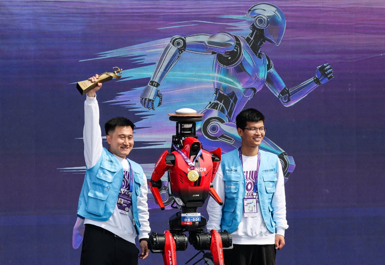 Humanoid robot beats human half-marathon world record in Beijing - CBS News