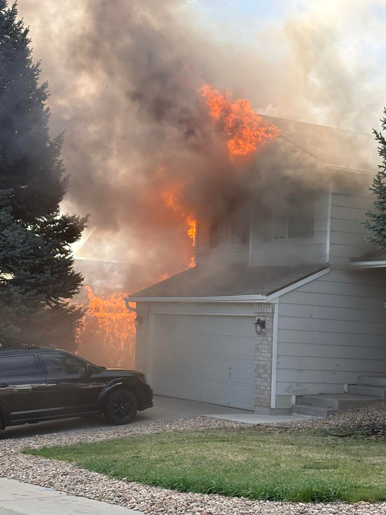 Colorado firefighter rushed to hospital as flames engulf home - CBS ...