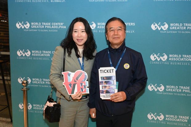 People post for photos at the WTC Greater Philadelphia Global Forum 