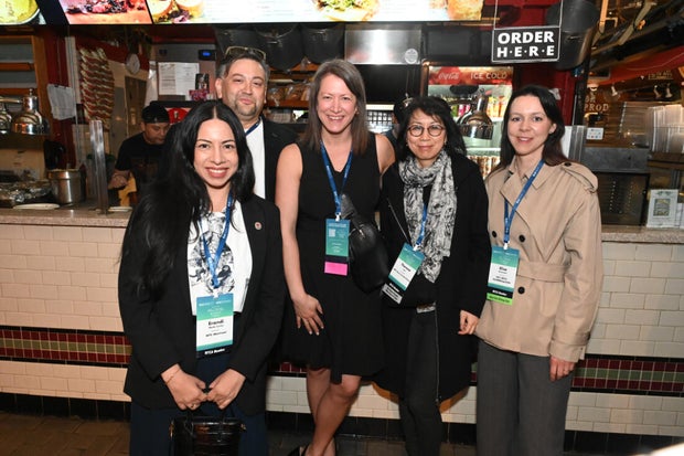 People post for photos at the WTC Greater Philadelphia Global Forum 