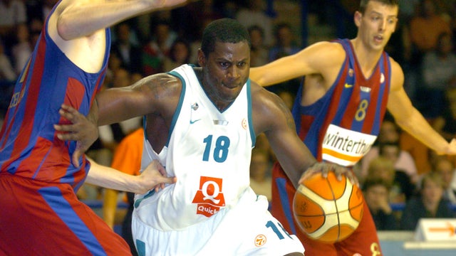 Elan Bearnais' Michael Wright, center, tries to pass Barcelona's Juan Carlos Navarro, left, as Jordi Trias, background, during their Basketball Euroleague match in Pau, southwestern France, Wednesday, Oct. 25, 2006. 