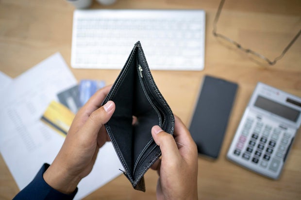 hand open empty purse looking for money having problem bankrupt broke 