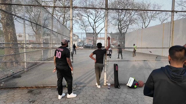 People hang out at a park in Queens 