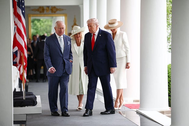 President Trump, first lady Melania Trump, Britain's King Charles III and Queen Camilla walk along the Colonnade to the Oval Office at the White House in Washington, D.C., on April 28, 2026. 