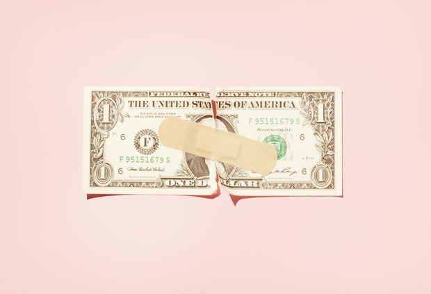 Torn $1 note with plaster. 