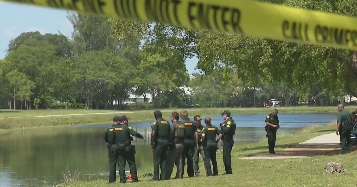 First Responders pull woman from car after it plunged into Pompano Beach canal