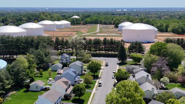 Drone image from overhead showing the tank farm and a residential neighborhood in Aston 