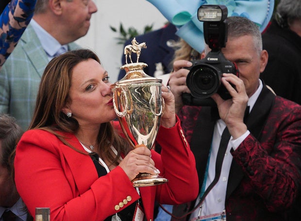 Golden Tempo's trainer Cherie DeVaux kisses the trophy after the Kentucky Derby at Churchill Downs, May 2, 2026, in Louisville, Kentucky. 