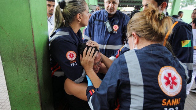 Shooting in school in Brazil kills two staff members dead, local authorities say 