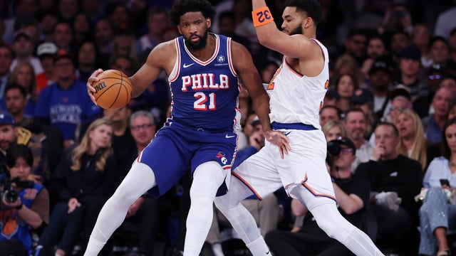 Joel Embiid has the ball against Karl-Anthony Towns of the New York Knicks during a playoff game at Madison Square Garden in New York City 