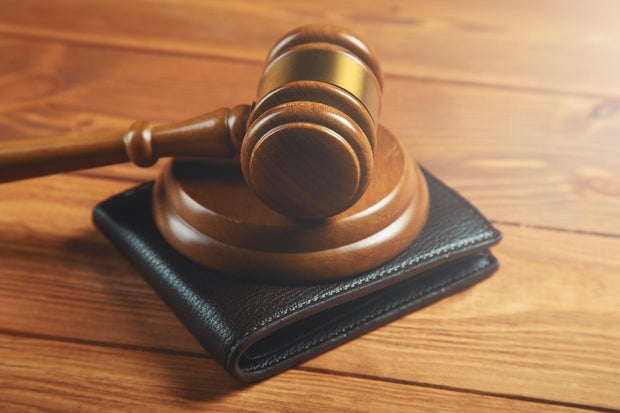 court gavel and wallet on the table 