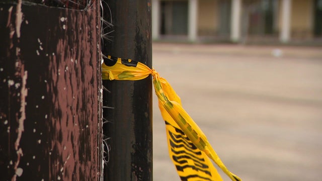Police LED lights flashing at the scene of a shooting 