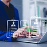 Recruitment and candidate selection concept. Businessman interacts with digital interface with multiple candidate profiles on laptop. Represents online recruitment, HR technology, hiring process, 