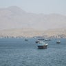 Vessels are seen in the Strait of Hormuz from Musandam, Oman, May 8, 2026. 