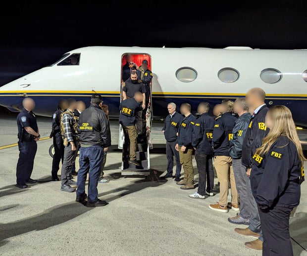 FBI photo of terror suspect getting off plane in custody in New York 