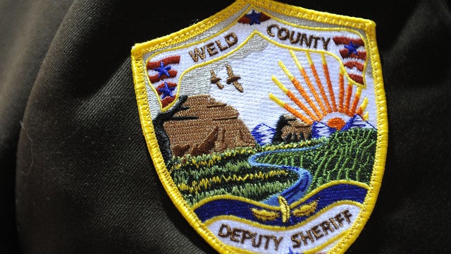 Officers place black tape over their badges in honor of their fallen comrade Weld County deputy sheriff Samuel Brownlee. Memorial services were held today November 29th, 2010 for Weld County Deputy Sheriff Samuel Kent Brownlee at Butler Hancock sports pav 