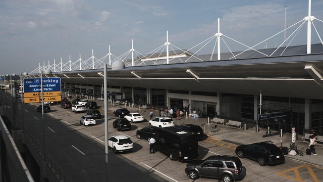 Travelers At Detroit Metro Airport As TSA Experiences Staff Shortages 