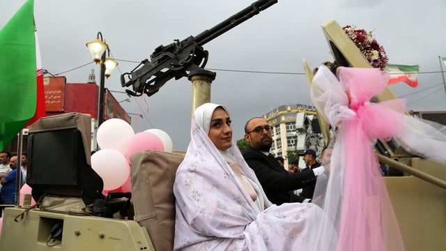 Decorated military vehicles used in Tehran wedding convoy 