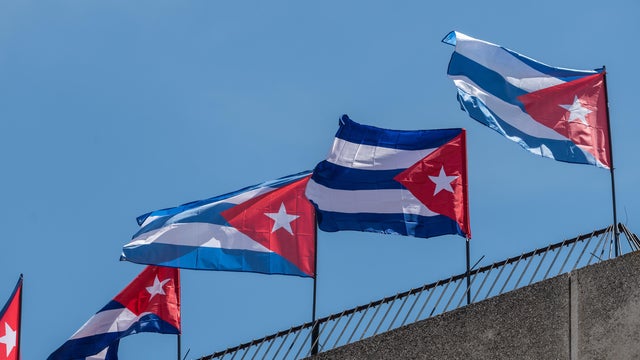 Cuban flags are seen on the rooftop of the Embassy of Cuba. 