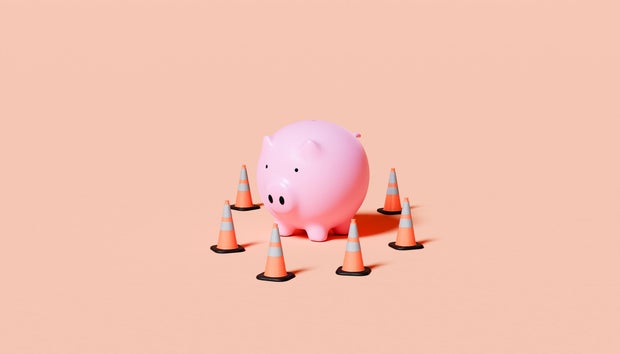 Piggy Bank Surrounded by Traffic Cones 