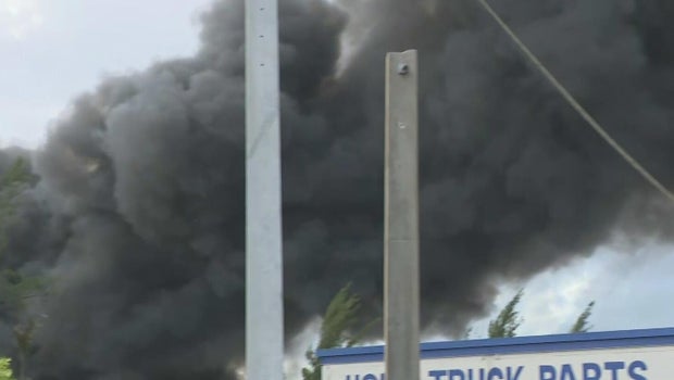 Massive five-alarm junkyard fire sends thick smoke over Opa-locka; no injuries reported