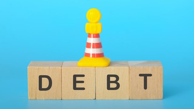 The image serves as a cautionary reminder of the challenges associated with debt and the importance of responsible financial management. 